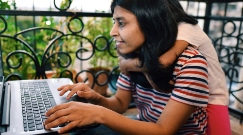mother and daughter on computer