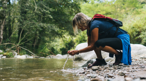 camper by stream